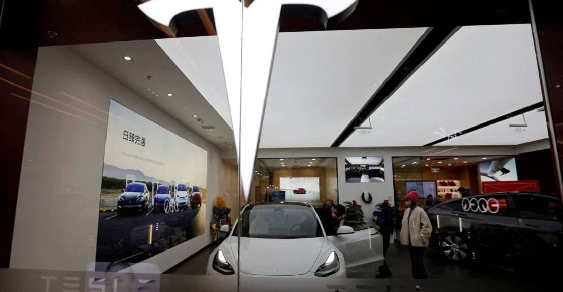 Visitors check peruse a Tesla showroom